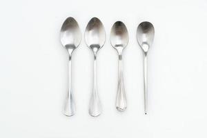 Silver spoon isolated on white background photo