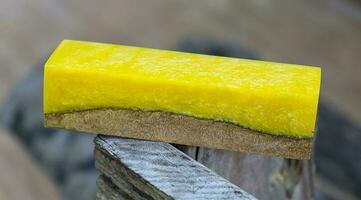 Casting epoxy resin maple burl wood on the table photo