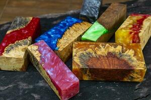 Casting epoxy resin maple burl wood on the table photo