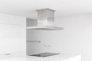 Cooker hood and electric stove of a modern and minimalist kitchen photo