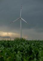 Windmill in stormy weather photo