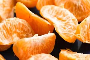 Slices of peeled tangerine photo