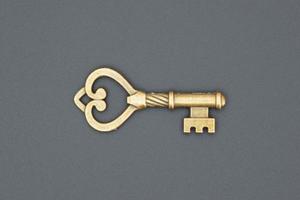 Old ornate key, vintage design element photo