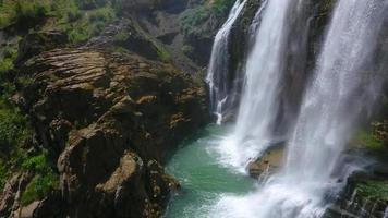 Waterfall between cliffs video