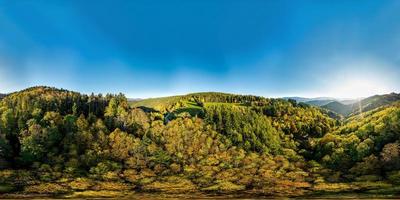 360-degree panoramic view above a multi-colored valley in the Vosges. photo
