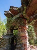 Stone gate. Mysterious structure in the forest in the Vosges Mountains Place of worship of the ancient Celts. photo