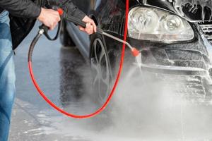 Car without touch washing self-service. Wash with water and foam. photo