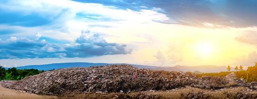 Polluted mountain large garbage pile and pollution photo