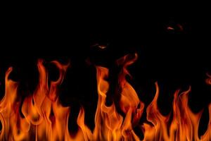 Fire flames with smoke on black background photo