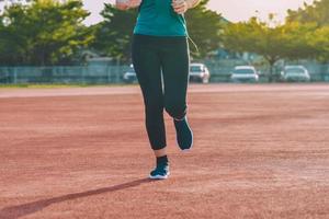 Runner Women jogging or running in evening at sunlight photo