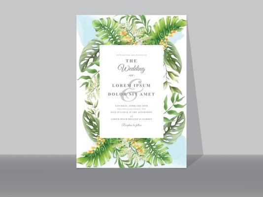 Wedding invitation cards with greenery tropical leaves