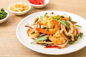 Stir-fried spicy sea food or Pad Cha Talay - Thai food style photo