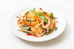 Stir-fried spicy sea food or Pad Cha Talay - Thai food style photo