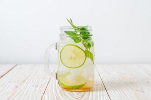 Iced honey and lime soda with mint - refreshing drink photo