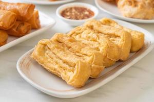 Fried tofu with sauce - vegan and vegetarian food style photo