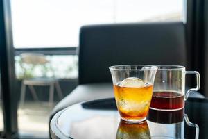 Cold drip Arabica black coffee in glass with ice ball photo