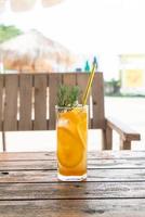 Orange juice soda with rosemary in cafe restaurant photo