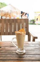 Caramel coffee nut smoothie milkshake glass in cafe and restaurant photo