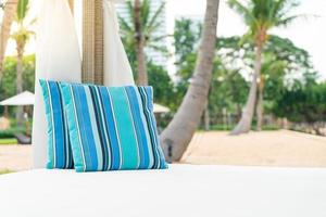 Comfortable pillow on pavilion near beach - travel and vacation concept photo