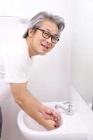 Hand Washing in Washbasin photo