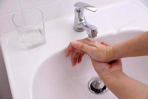 Hand Washing in Washbasin photo