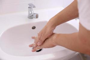 Hand Washing in Washbasin photo