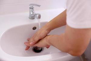 Hand Washing in Washbasin photo