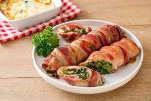 Baked bacon roll stuffed spinach and cheese photo