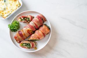 Baked bacon roll stuffed spinach and cheese photo