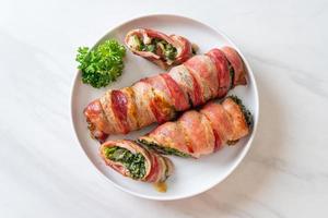 Baked bacon roll stuffed spinach and cheese photo