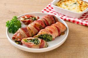 Baked bacon roll stuffed spinach and cheese photo