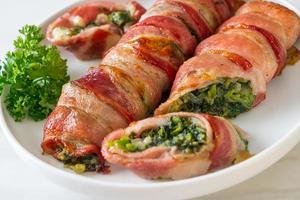 Baked bacon roll stuffed spinach and cheese photo