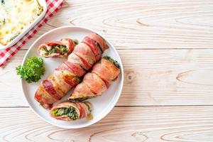 Baked bacon roll stuffed spinach and cheese photo