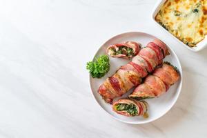 Baked bacon roll stuffed spinach and cheese photo