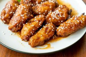 Fried chicken with Korean spicy sauce and white sesame