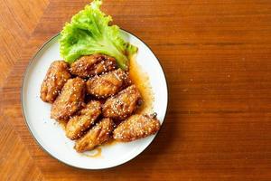 Fried chicken with Korean spicy sauce and white sesame
