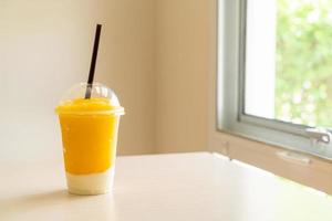 Fresh mango fruit smoothies with yogurt glass photo