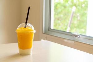 Fresh mango fruit smoothies with yogurt glass photo