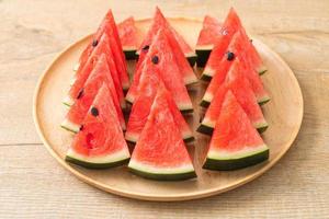Fresh watermelon sliced on wooden plate