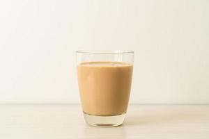 Coffee latte glass with ready to drink coffee bottles on the table photo