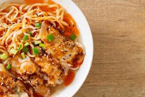 Ramen noodles with gyoza or pork dumplings - Asian food style photo