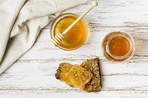 Top view honey jars with honeycomb. High quality beautiful photo concept
