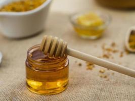 Wooden dipper sticky honey. High quality beautiful photo concept