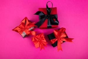 A set of gifts and surprises in bright boxes decorated with ribbons photo