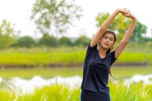 Portrait of beautiful girl in sportswear smiling during exercise photo