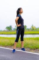 Portrait of beautiful girl in sportswear smiling during exercise photo