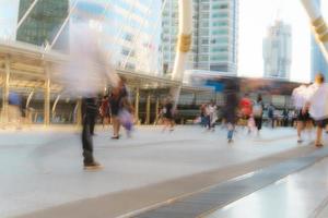 People walking in motion blur in the city photo