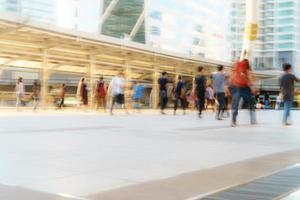 People walking in motion blur in the city photo