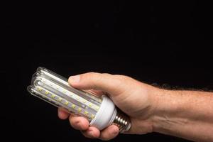 Energy-saving bulb, ready to be installed photo