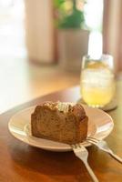 Banana cake on plate in cafe restaurant - soft selective focus point photo